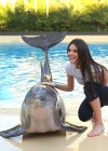 Kendall Jenner having fun with dolphin in a zoo in Las Vegas